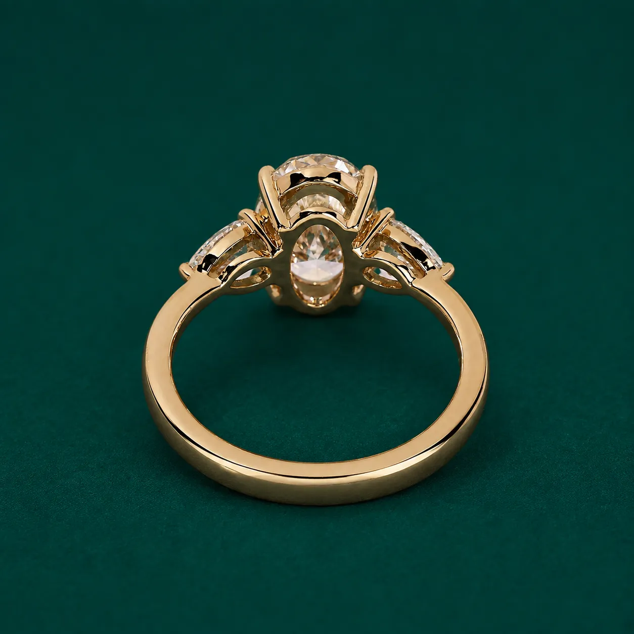 Close up of lab grown diamond three stone engagement ring