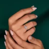 Close up of marquise lab grown diamond ring with six claw prongs
