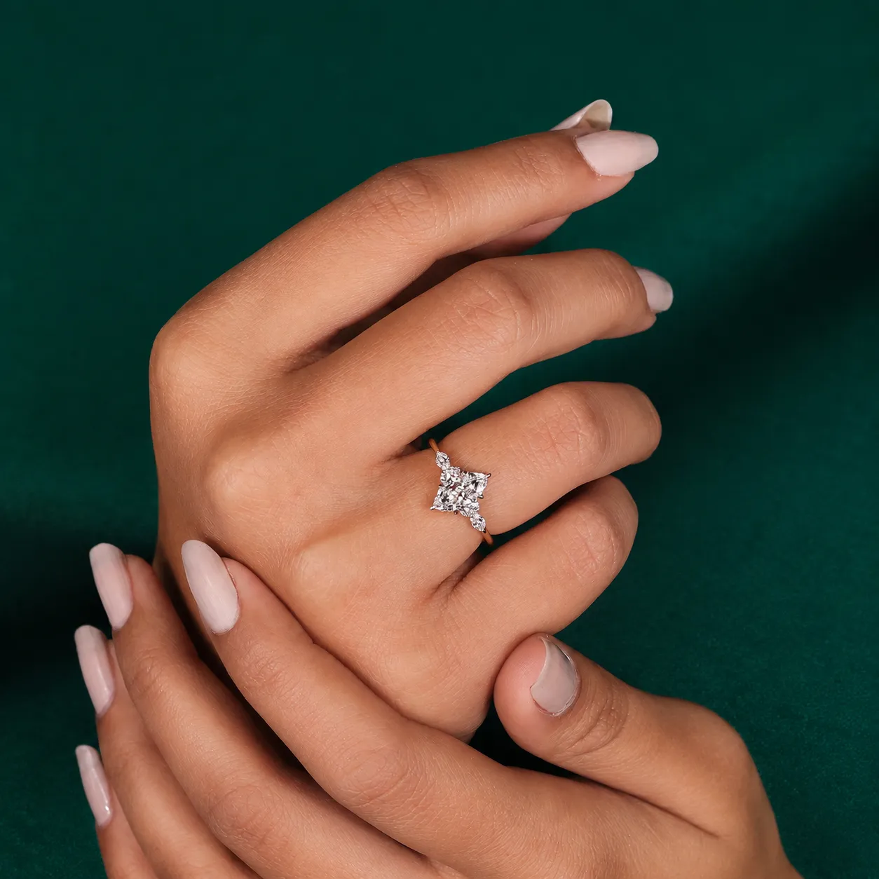 Close up of marquise lab grown diamond ring with six claw prongs