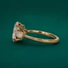 Oval diamond ring with side pear shaped diamonds